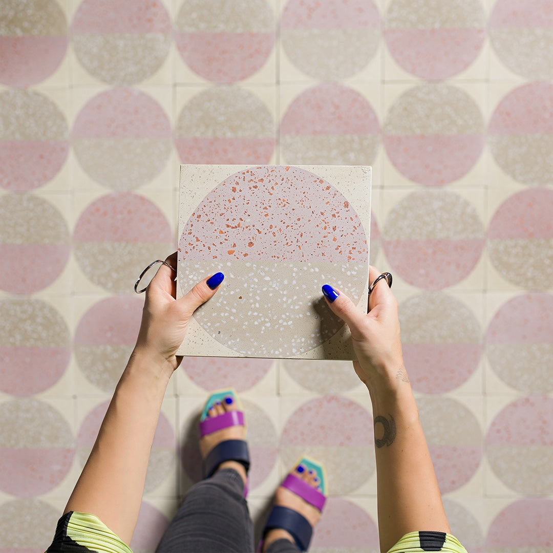 Square cement tile design featuring a terrazzo-style circular pattern in blush pink and beige tones with speckled texture, ideal for modern flooring, wall cladding, or contemporary interior decor.