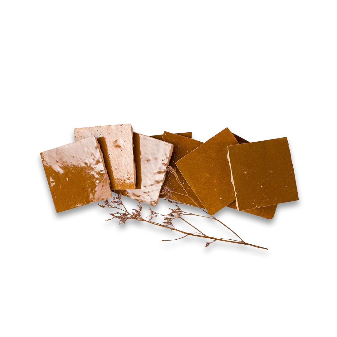 Brown square tiles on a white background with a small branch.