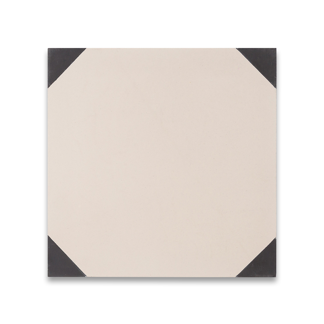 Charcoal Edge cement tile featuring a cream base with matte black corner accents, ideal for modern interiors, flooring, and wall applications.