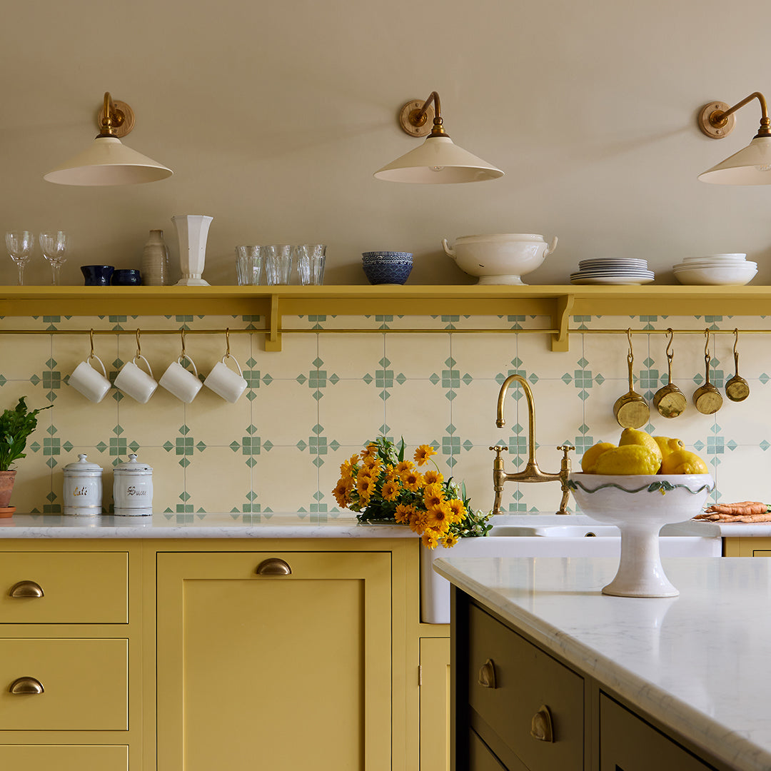 Sage Edge cement tile featuring a soft cream base with muted sage green corner accents, ideal for modern interiors, patterned flooring, and wall applications in contemporary spaces.