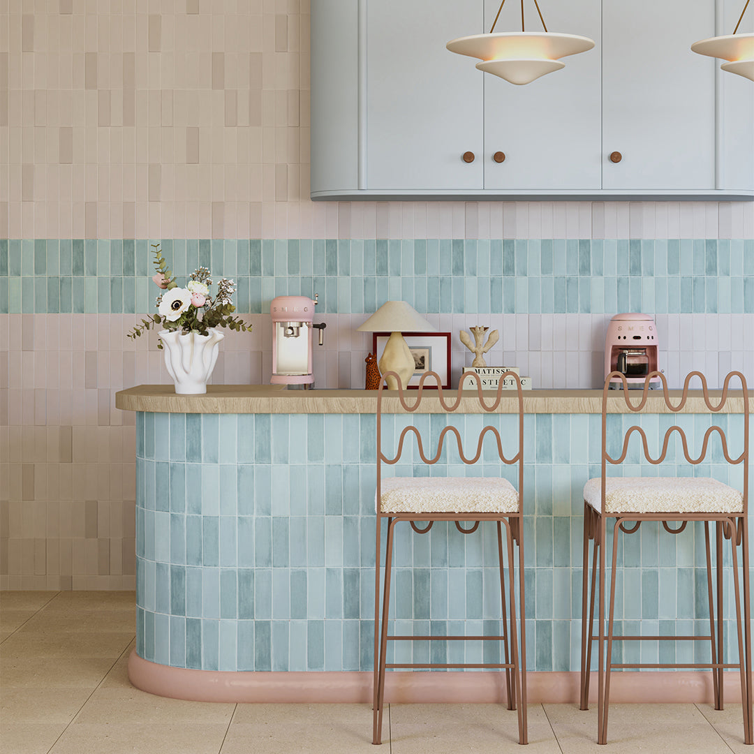 Kitchen with a bar area featuring tiled walls and wooden counter.