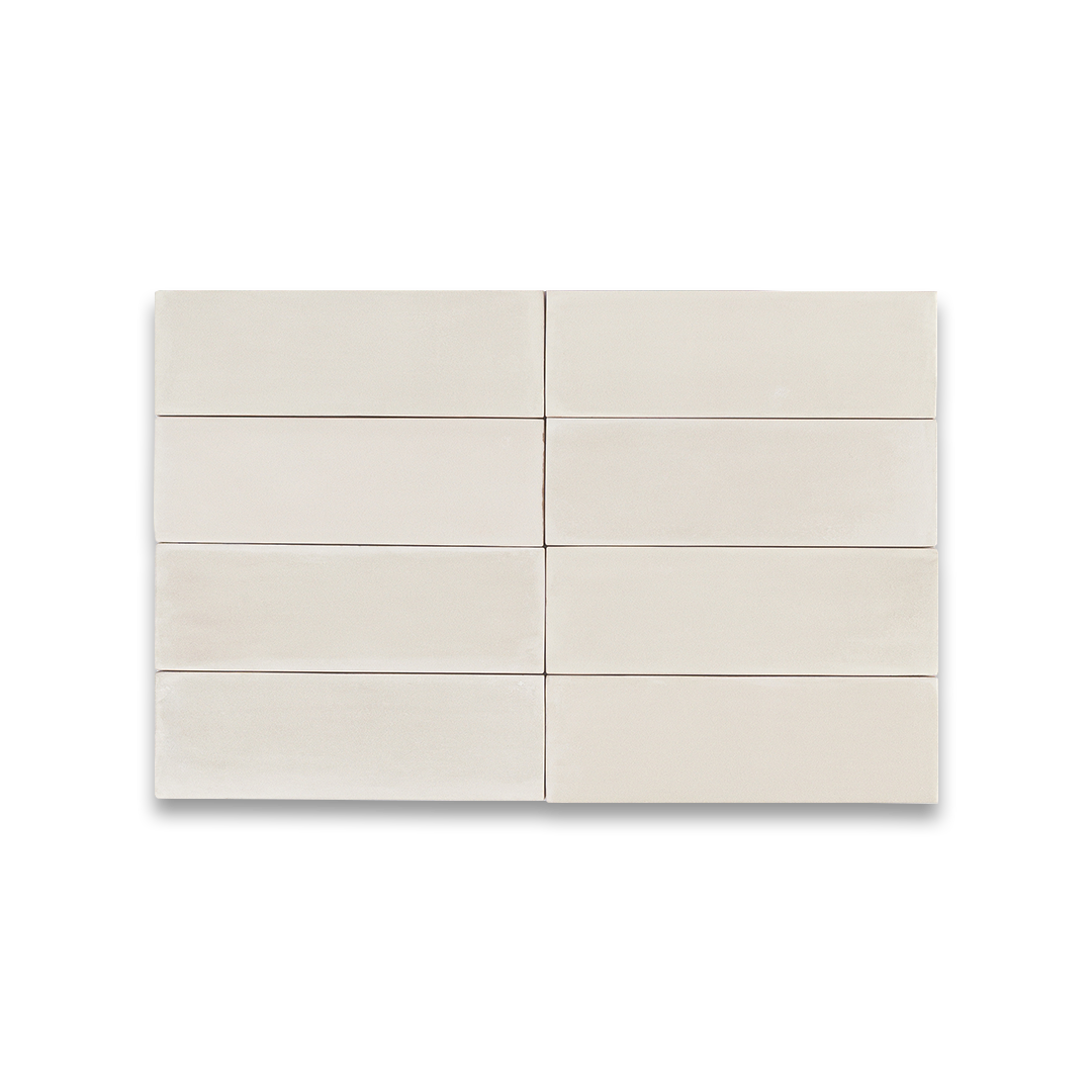 Beige ceramic tiles arranged in a grid pattern on a white background