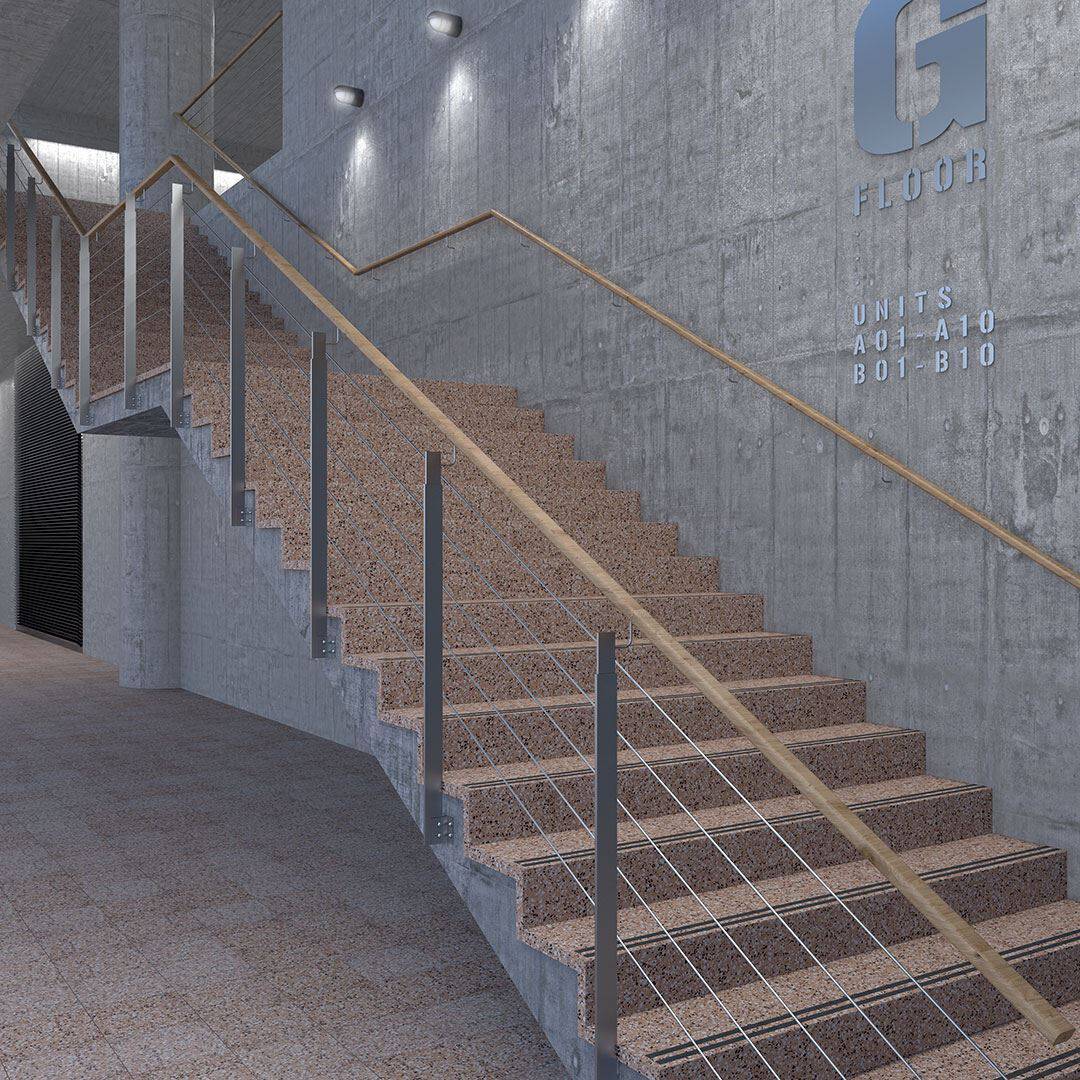 Modern concrete staircase with terrazzo steps, metal railing, and minimalist industrial interior design.