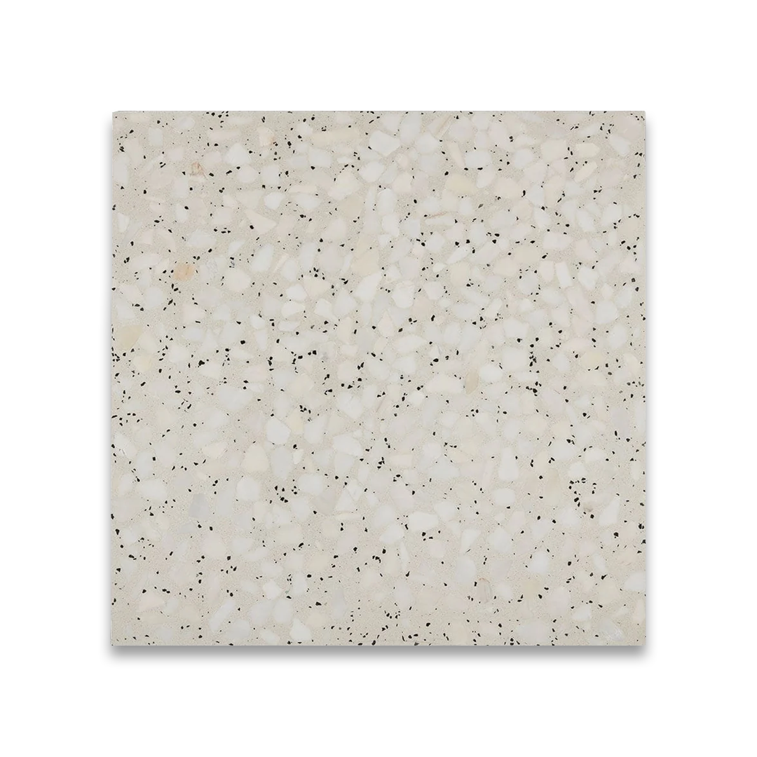 Square tile with a speckled pattern on a white background