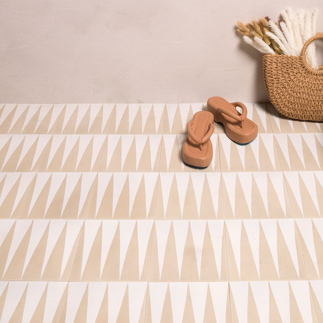 An alternating beige and white elongated triangular patterns forming a geometric zigzag motif, ideal for modern flooring, wall accents, or Scandinavian-inspired interior decor.