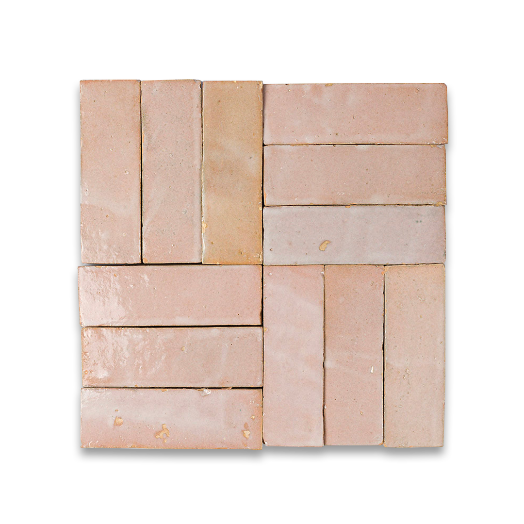 Square arrangement of stone tiles with various shades of brown on a white background
