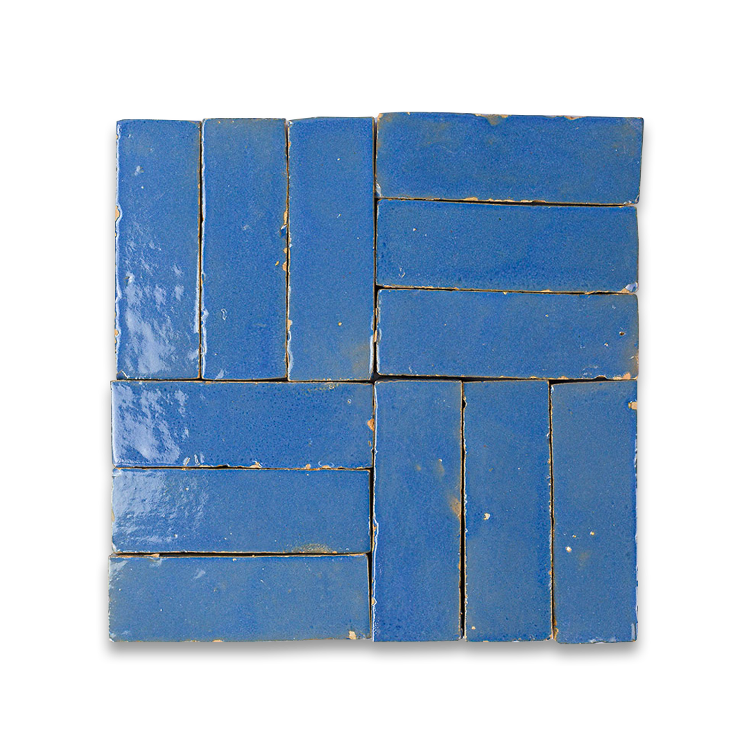 Blue ceramic tiles arranged in a pattern on a white background