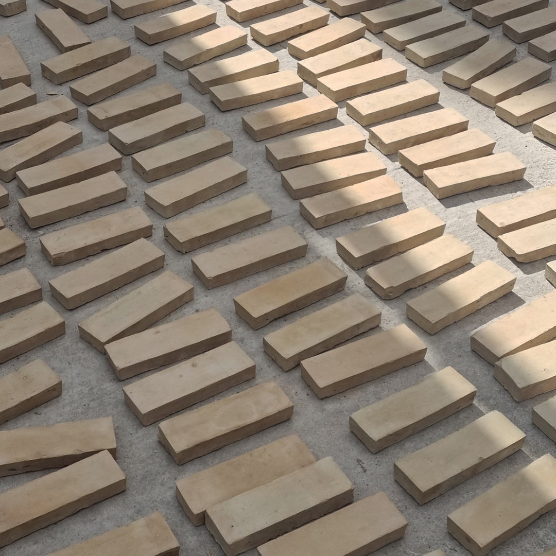 Pattern of rectangular stone bricks on a concrete surface