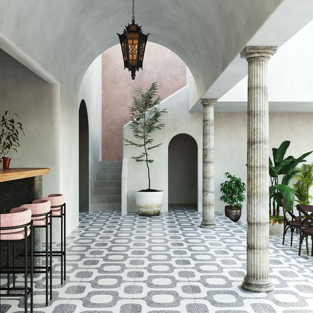 A square cement tile featuring a white background with curved gray terrazzo patterns forming abstract geometric shapes, creating a modern, retro-inspired, and textured decorative design.