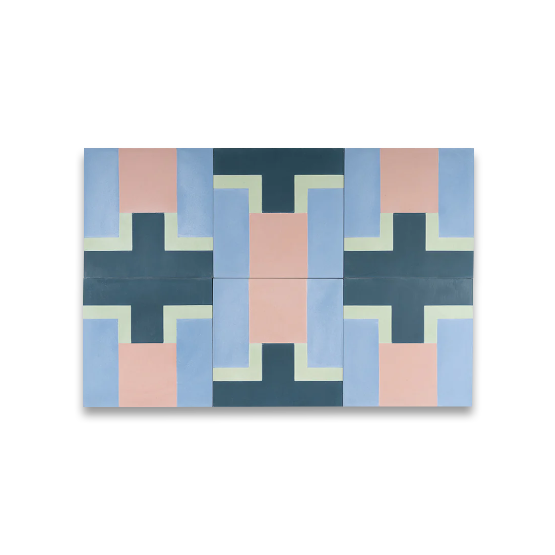 Geometric patterned rug with blue, pink, and green colors on a white background