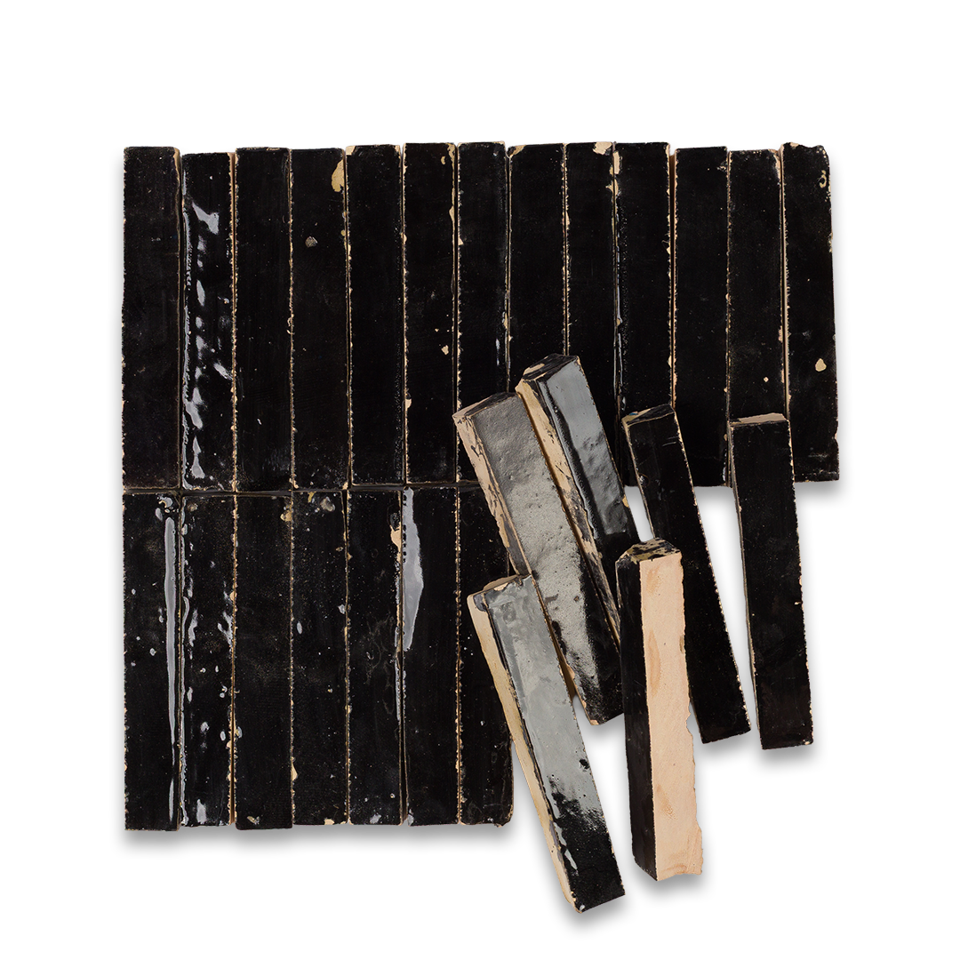 Black rectangular tiles with a glossy finish on a white background