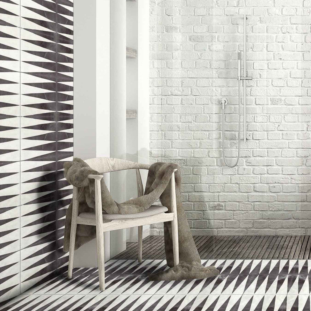 Modern bathroom with geometric tile patterns on walls and floor.