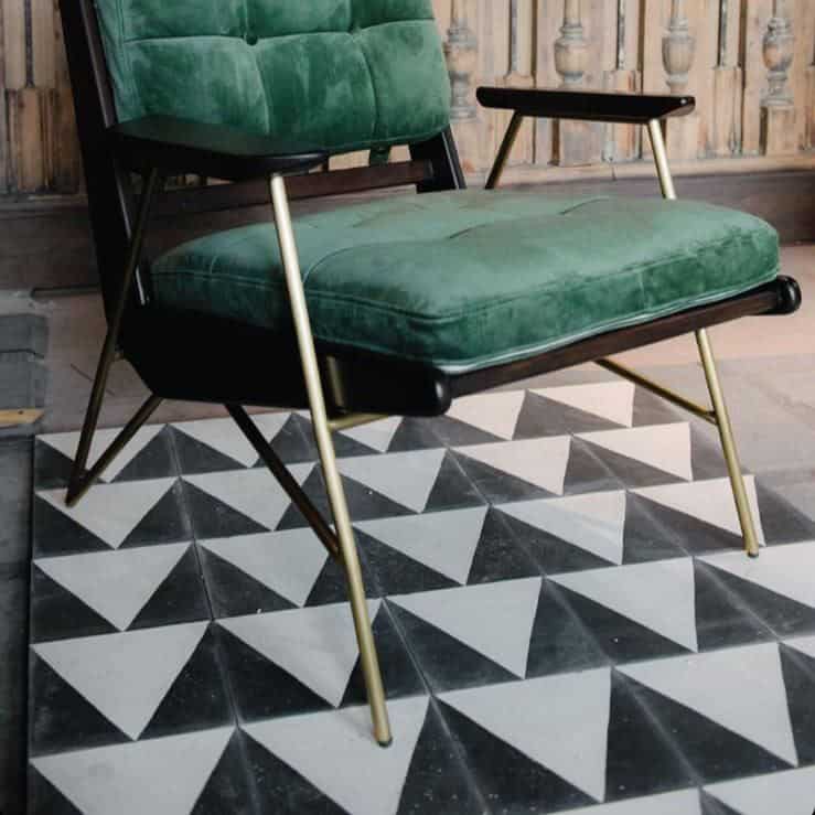 Monochrome Peak cement tile featuring a bold black triangular border framing a cream center, ideal for modern interiors, geometric flooring, and accent wall applications in contemporary spaces.