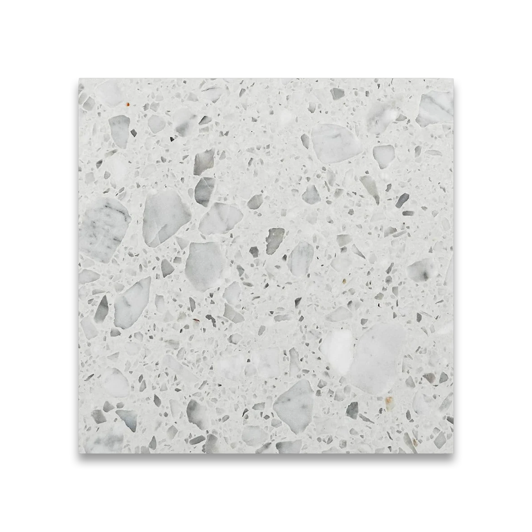 Terrazzo tile with a speckled pattern on a white background