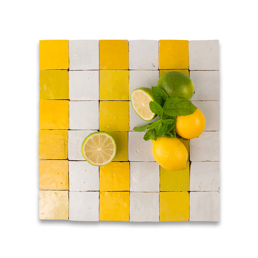 Checkered tile cutting board with lemons and limes