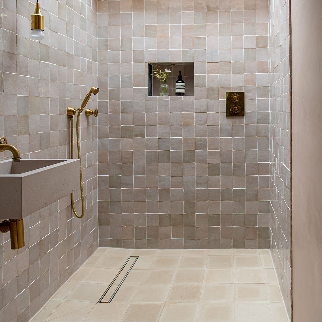 Matte cream square cement tile featuring a smooth, uniform surface with subtle texture, ideal for minimalist interiors, modern flooring, and wall applications in contemporary residential spaces.