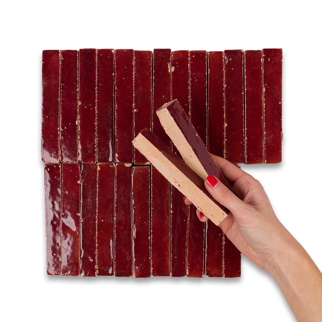 Mosaic tile with red and brown rectangular tiles on a white background