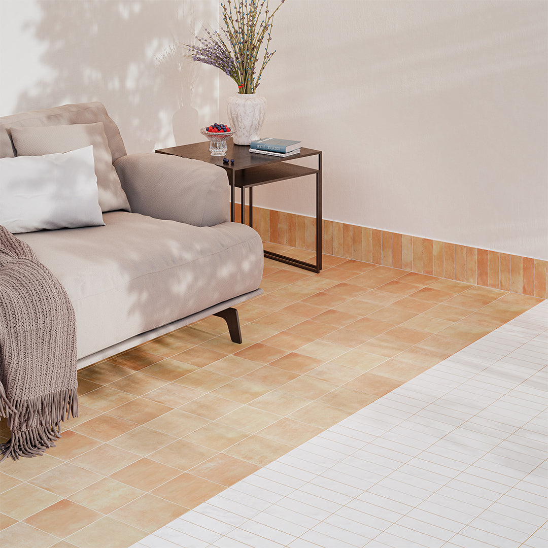 Living room with a beige sofa, small table, and decorative elements.