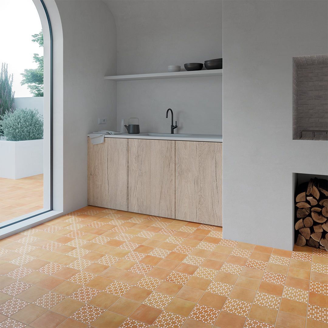 Modern kitchen with wooden cabinets and a patterned tile floor.