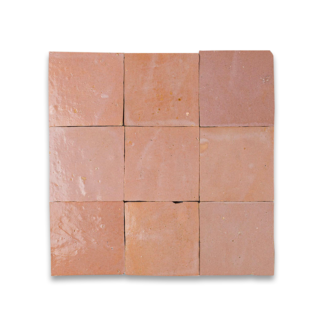 A grid of nine terracotta tiles arranged in a 3×3 pattern. Each tile varies slightly in shade of reddish-brown, with surface imperfections like pits, scratches, and texture variations.