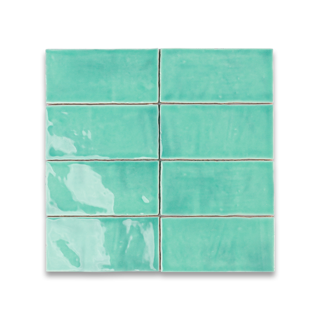 Set of six turquoise ceramic tiles on a white background