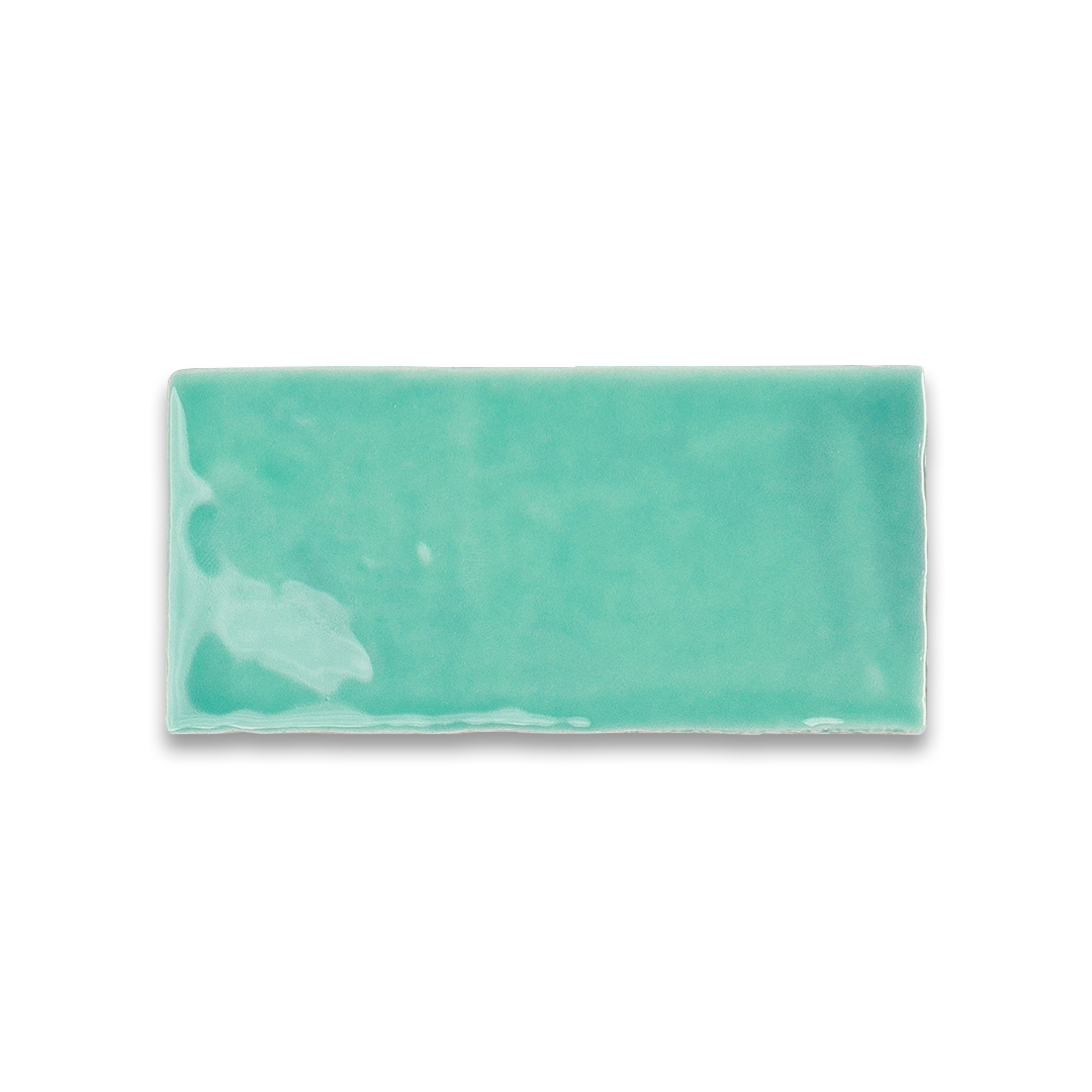 Rectangular turquoise ceramic tile on a white background
