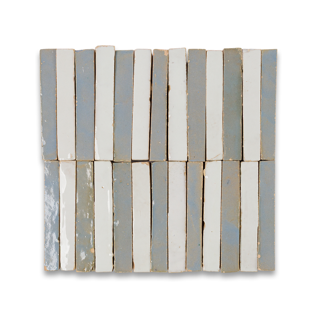 White ceramic tiles arranged on a black background, creating a striking contrast in color and texture.