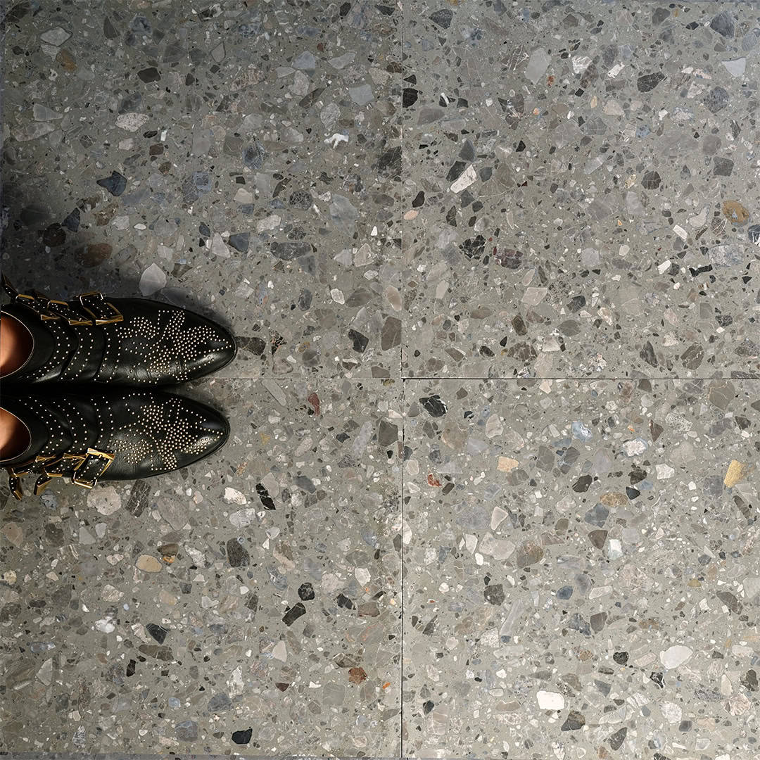Terrazzo tile with a gray and multicolor pattern.