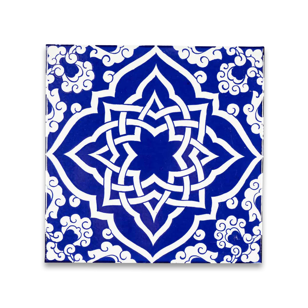 Blue and white decorative tile with intricate pattern.