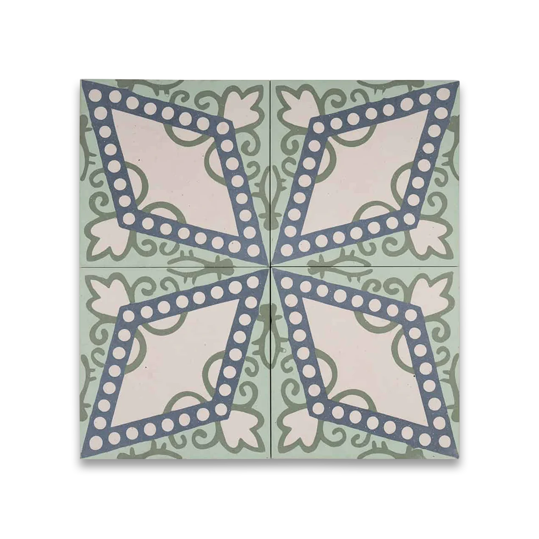 Square blue metro cement tile featuring a central diamond pattern with white circular dots and green floral motifs, ideal for vintage flooring, wall décor, and Mediterranean interior design applications.