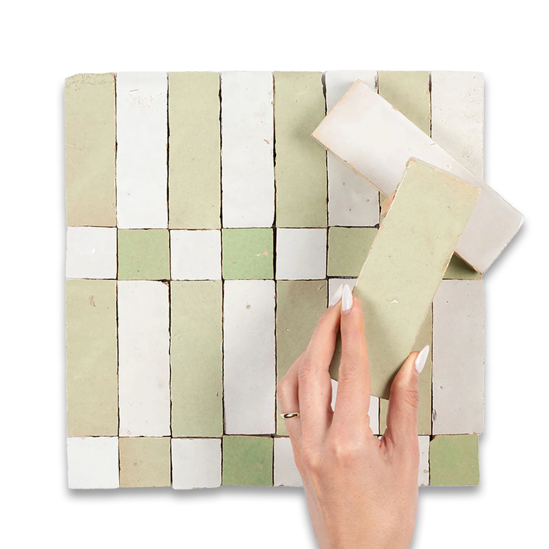 Hand holding a woven mat with a checkered pattern against a white background