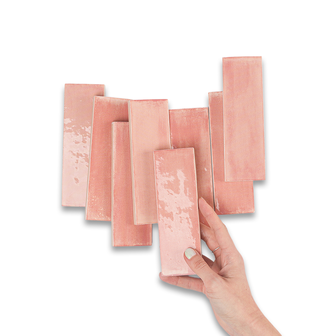 Set of pink rectangular napkins with a hand holding one.