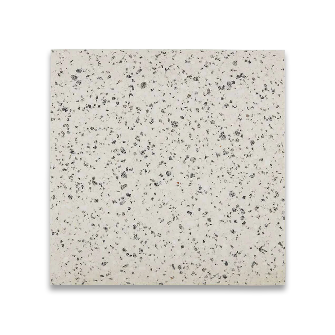 Square tile with a speckled pattern on a white background
