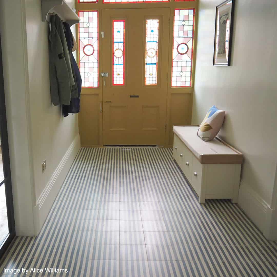 Square blue metro cement tile featuring alternating vertical navy and white stripes with a matte finish, ideal for modern flooring, wall décor, and contemporary interior design applications.