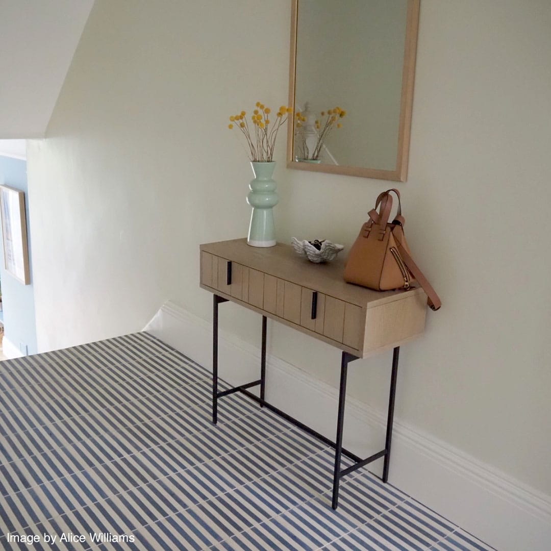 Square blue metro cement tile featuring alternating vertical navy and white stripes with a matte finish, ideal for modern flooring, wall décor, and contemporary interior design applications.