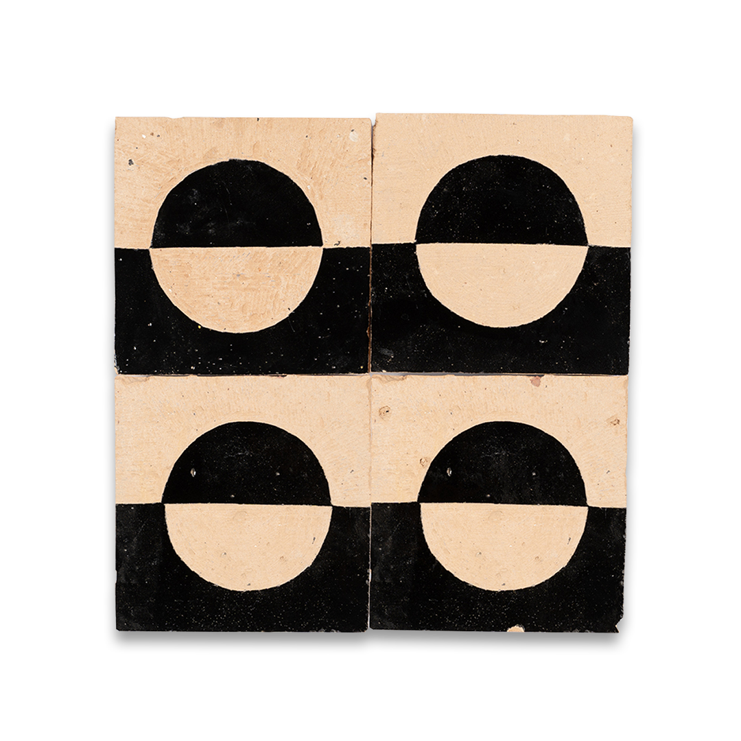 Four square tiles with black and beige circular patterns on a white background