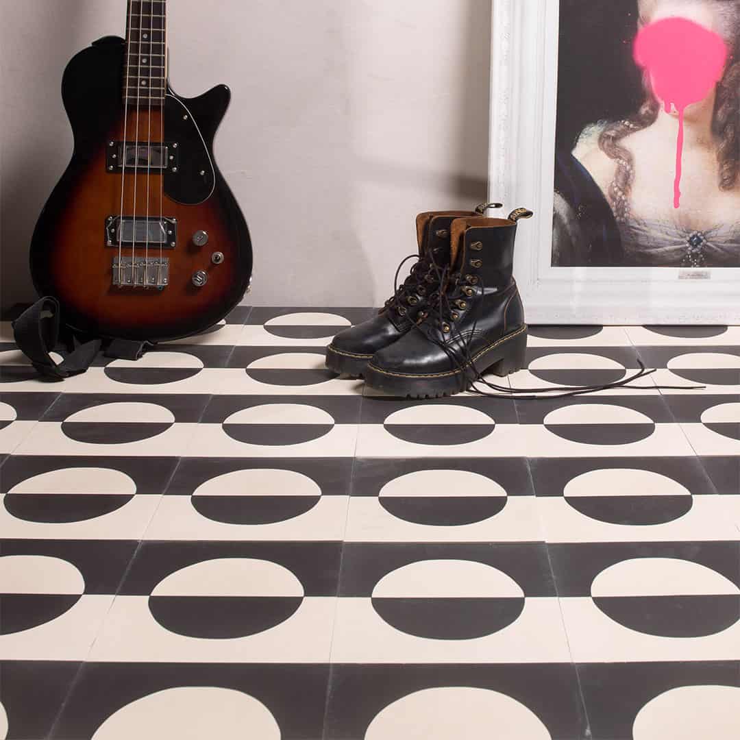 Black and white geometric cement tile featuring a bold circular half-moon pattern, minimalist modern design, matte finish, ideal for contemporary flooring, wall décor, and architectural interior applications.