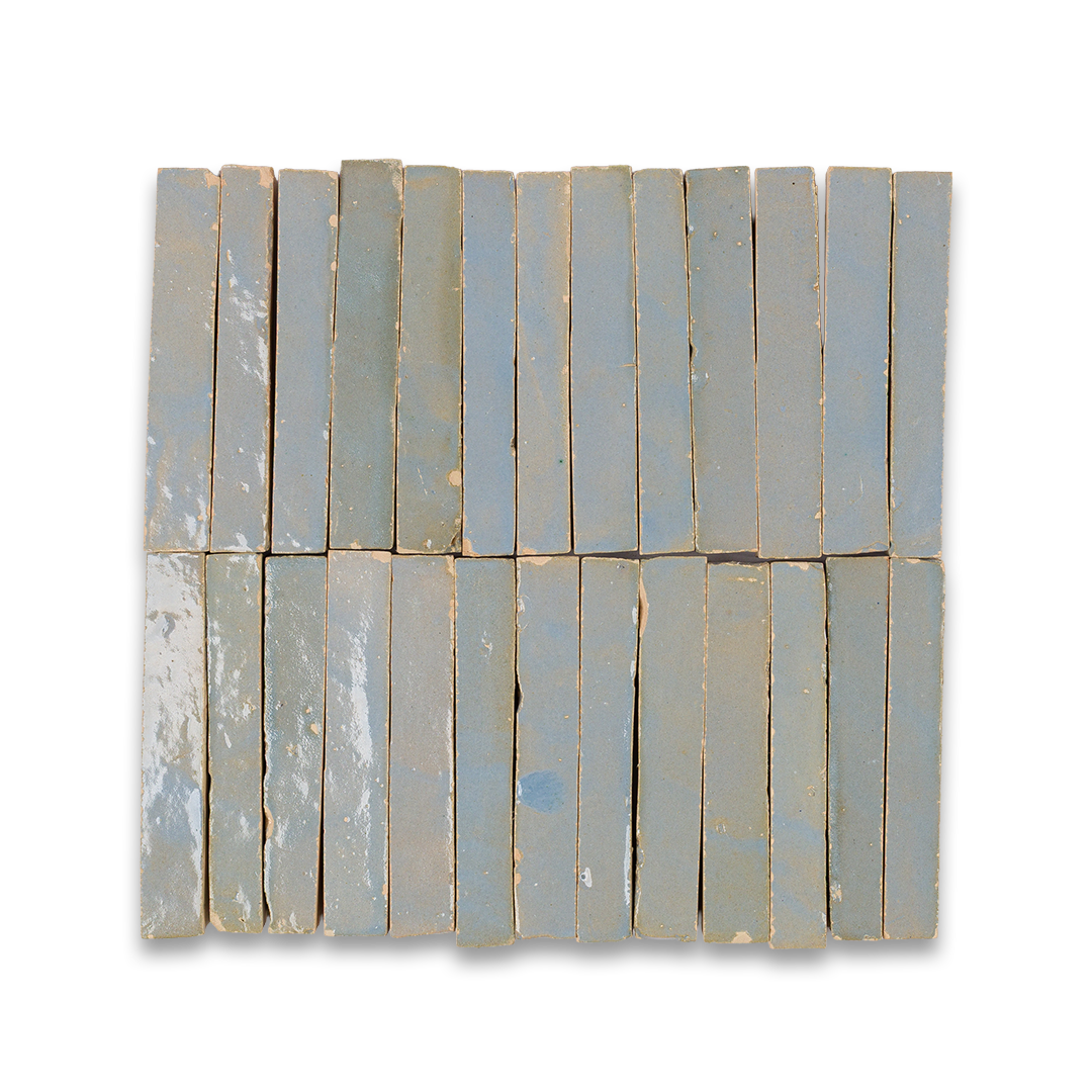 A detailed close-up of a collection of blue tiles, highlighting their shapes and shades in a stacked arrangement.