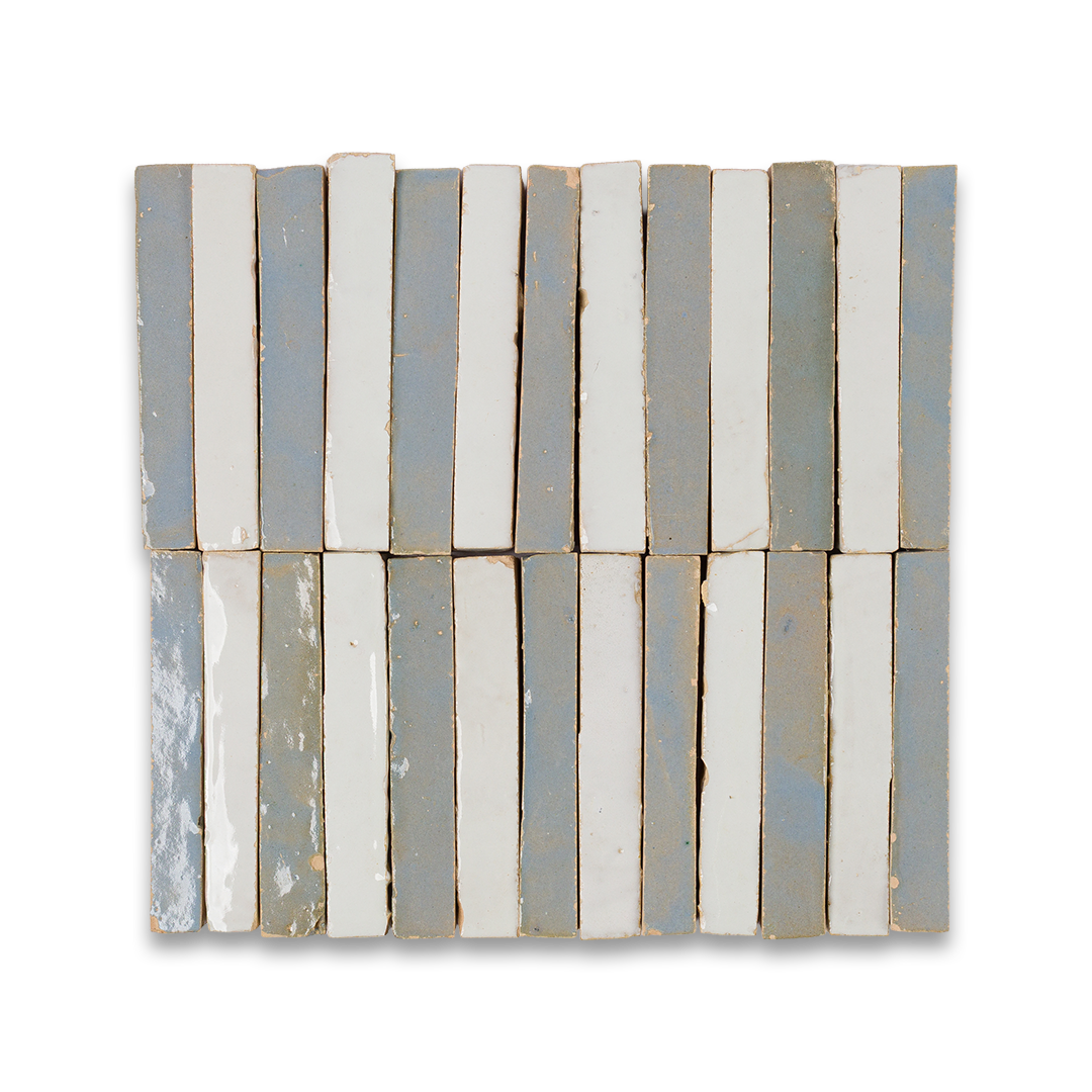 A detailed close-up of a collection of blue tiles, highlighting their shapes and shades in a stacked arrangement.