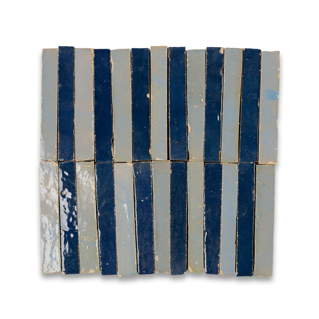 A detailed close-up of a collection of blue tiles, highlighting their shapes and shades in a stacked arrangement.