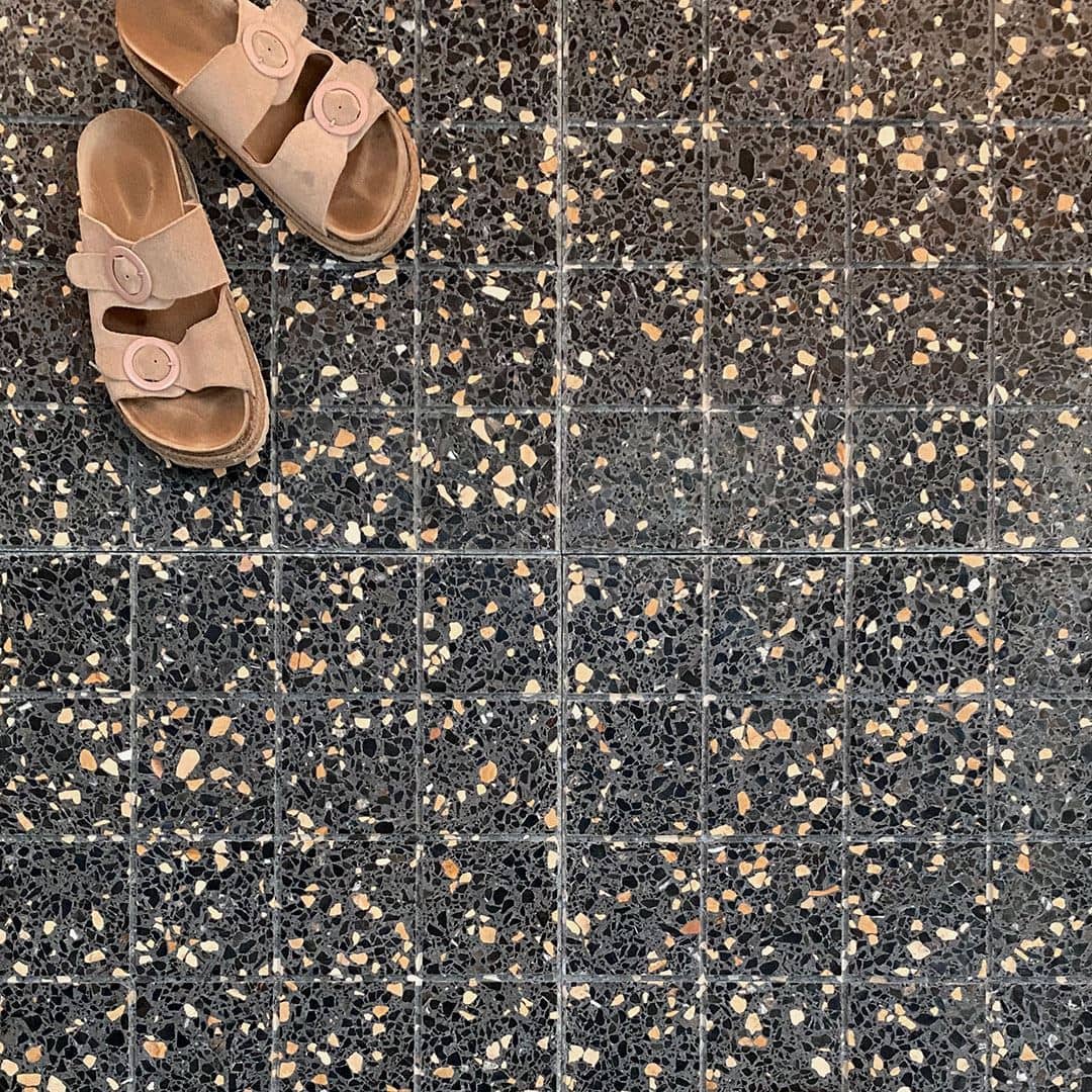 Terrazzo tiles with a speckled pattern