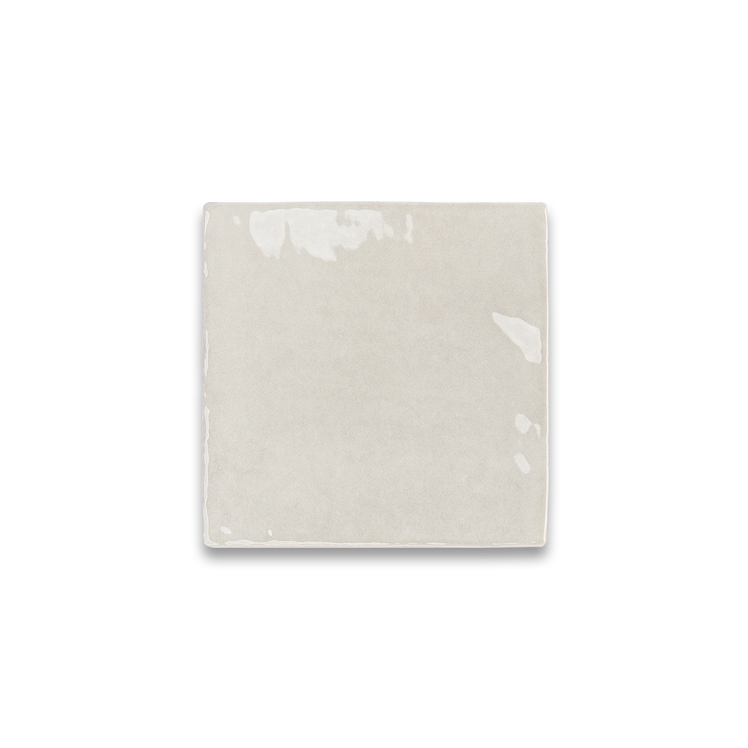 Rectangular ceramic tile with subtle pattern on a white background