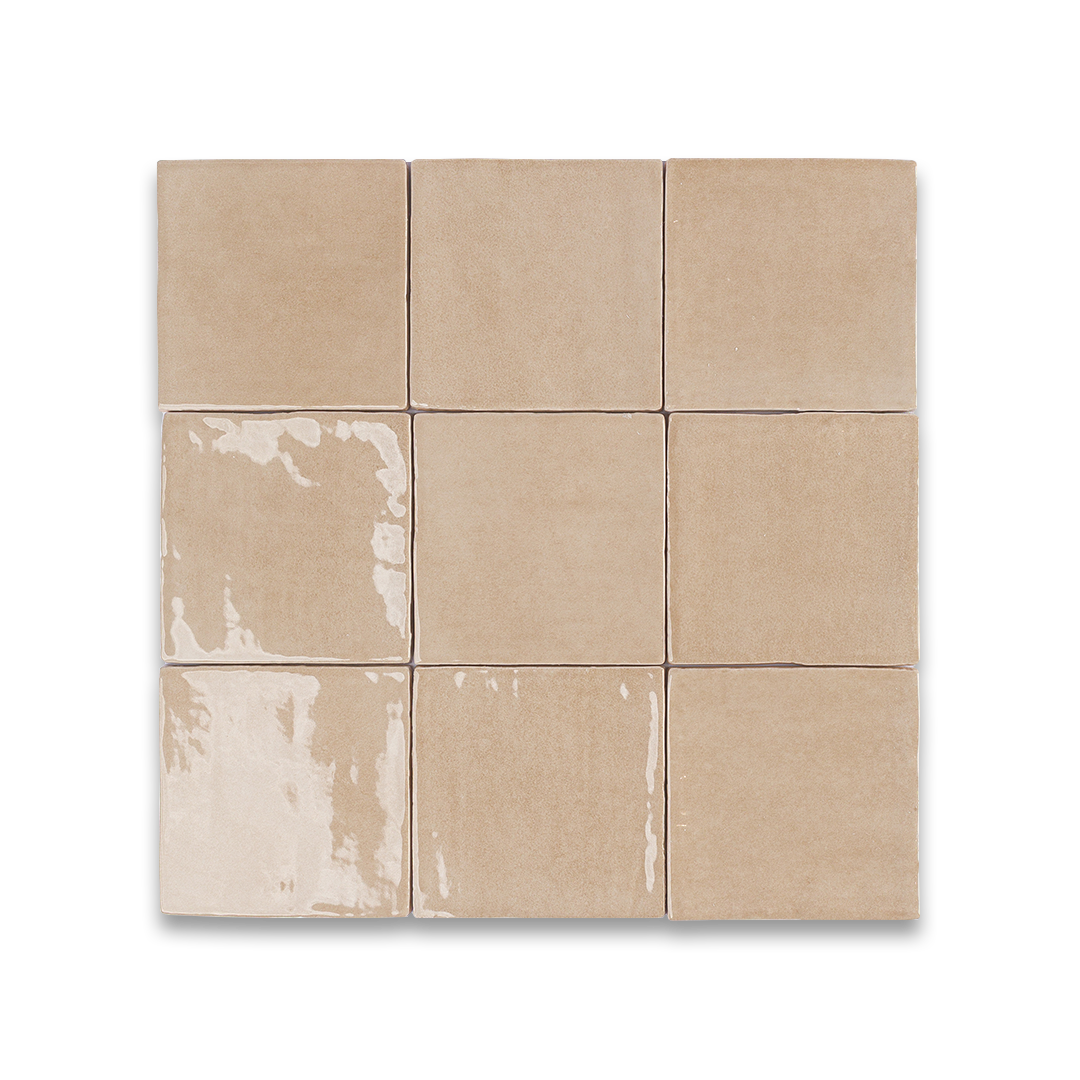 Set of beige tiles with a subtle pattern on a white background