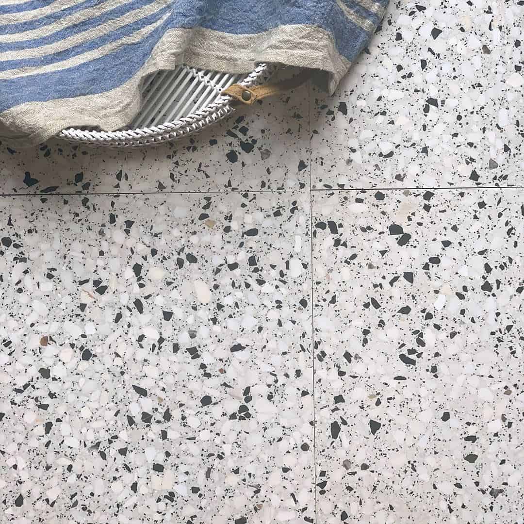 Light gray terrazzo surface.