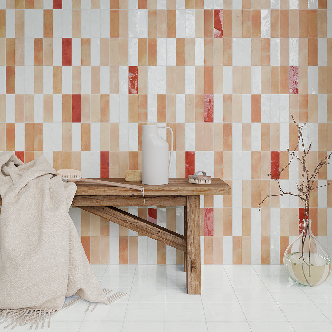Patterned wall tiles with a wooden table and decorative items in a room setting.