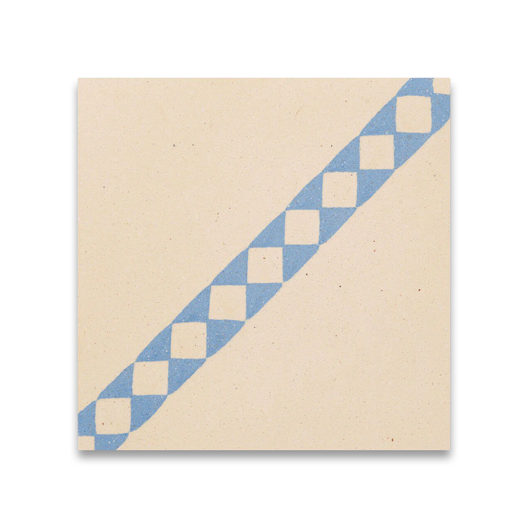 Azure Lattice cement tile featuring a cream base with a diagonal blue diamond pattern, ideal for vintage-inspired interiors, decorative flooring, and wall applications in modern Mediterranean spaces.