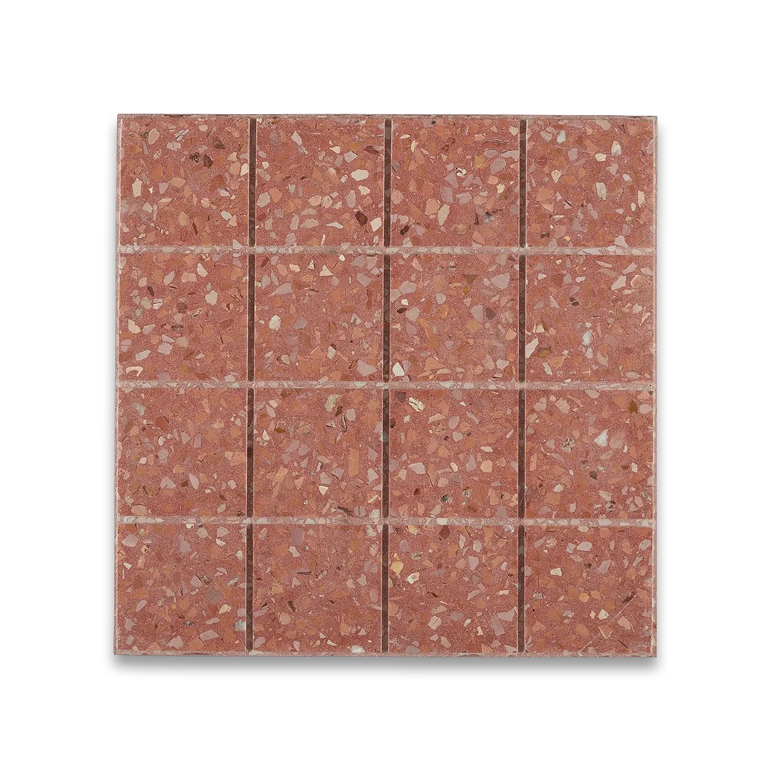 Terracotta tiles with a speckled pattern on a white background