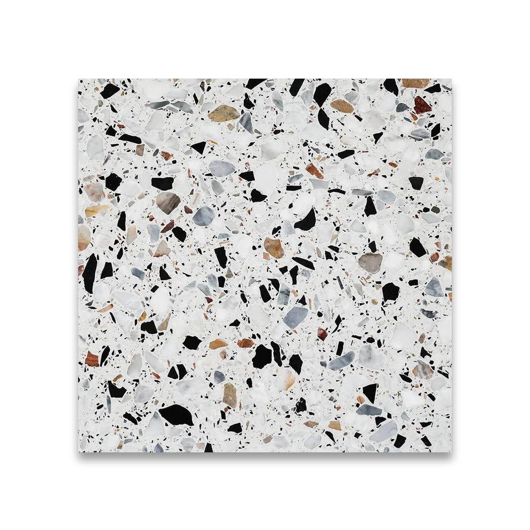 Terrazzo patterned tile with multicolored speckles on a white background