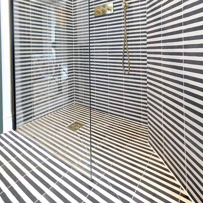 Square green metro cement tile featuring alternating vertical navy blue and white stripes with a matte finish, ideal for modern flooring, wall cladding, and contemporary interior design applications.