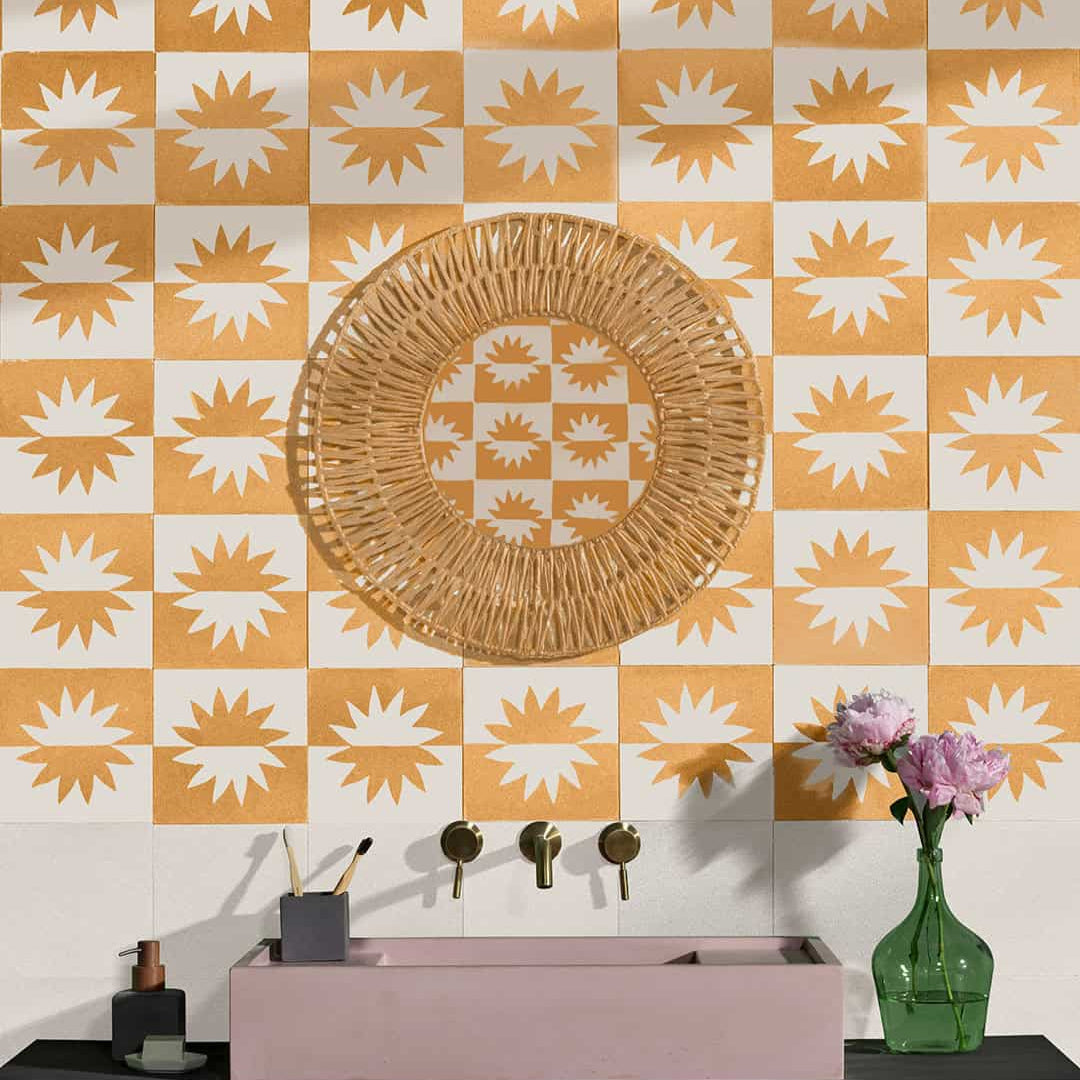 Square cement tile design featuring a mirrored sunburst pattern in mustard yellow and off-white tones with a matte finish, ideal for modern flooring, wall decor, or Mediterranean interiors.